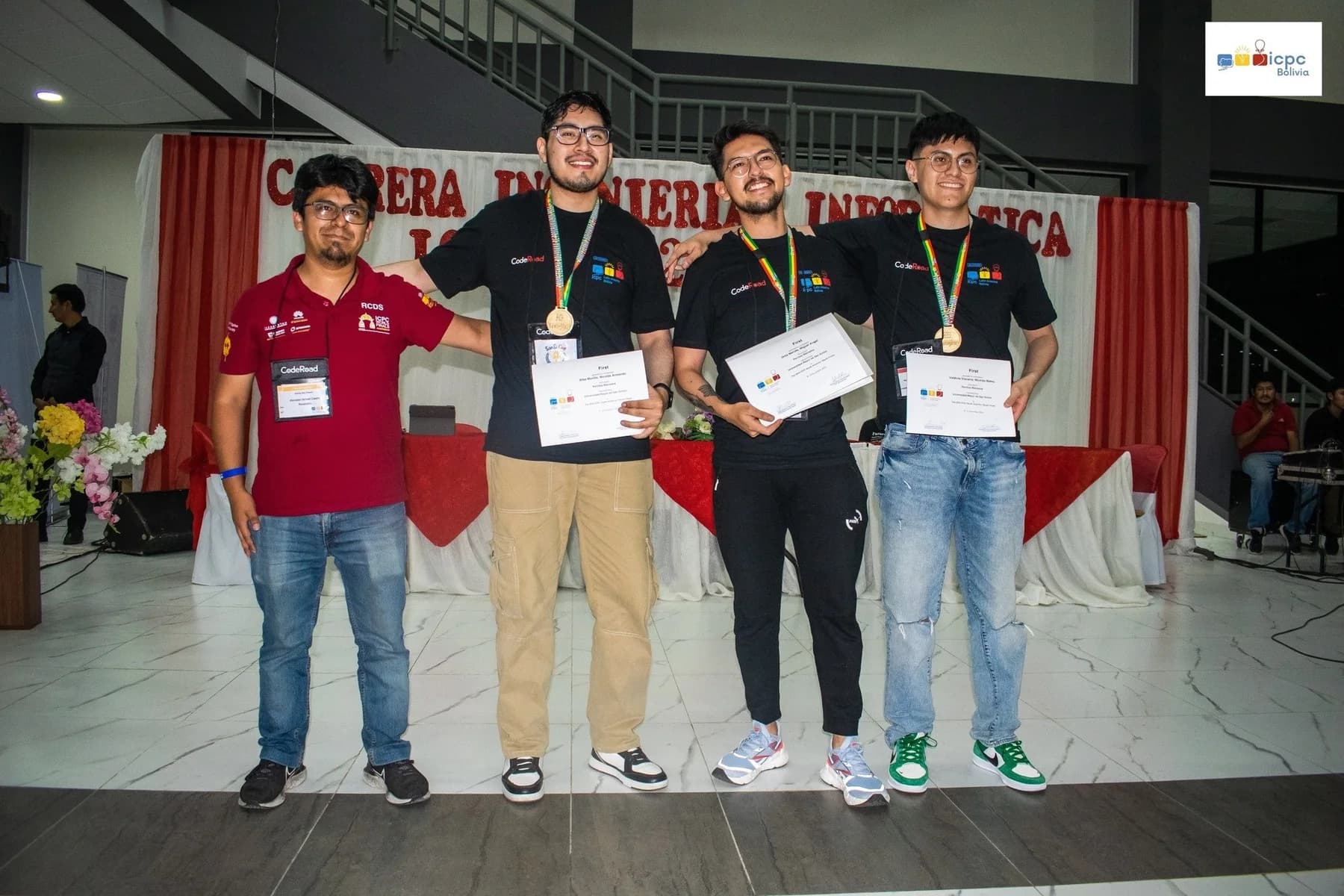 Perritos Malvados receiving gold medals after winning ICPC Bolivia 2024